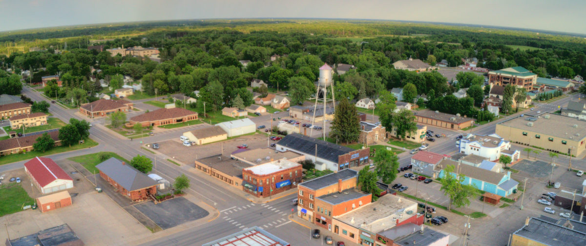 Aerial shot of small town with water tower