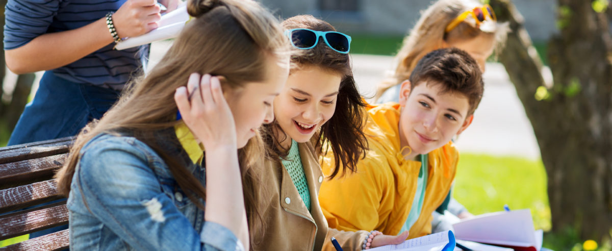 Kids sitting on a bench