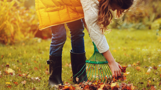 girl raking leaves