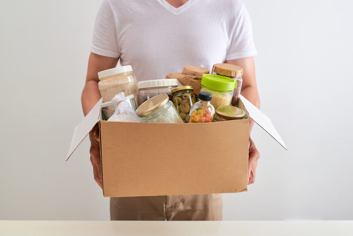 man holding box of food