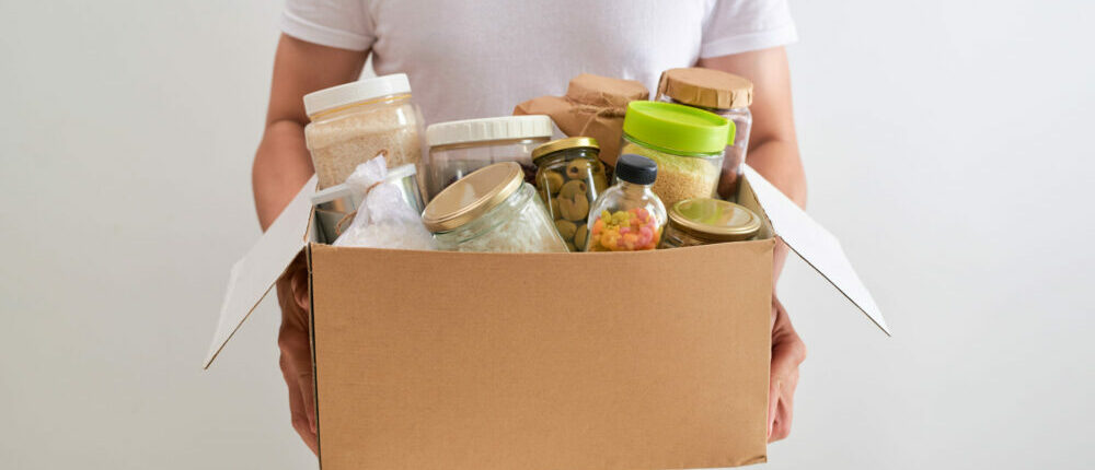 man holding box of food