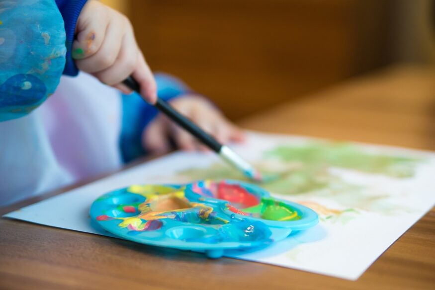 child painting on a table