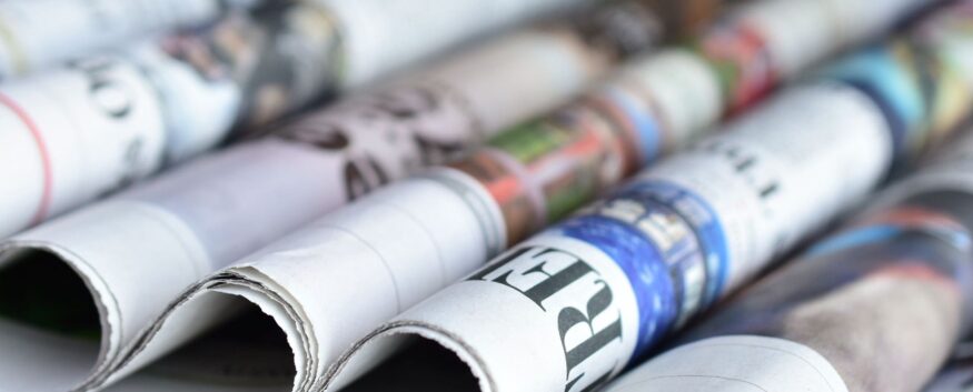 Row of folded newspapers